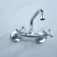StarTech.com Grifo de cocina - Montaje en pared - Caño giratorio - Dos mandos - Agua caliente/fría - Cartucho cerámico - Latón macizo - Cromo - Plateado