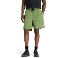 New Balance Pantalón deportivo 'Castlefield Woven Short 7"' verde / verde hierba