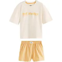 Self. Pijama beige / naranja / negro / blanco
