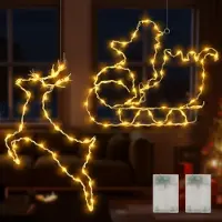 OEM Juego de dos figuras decorativas navideñas con luces LED, representando a un hombre con trineo. Ideal para decorar ventanas en Navidad